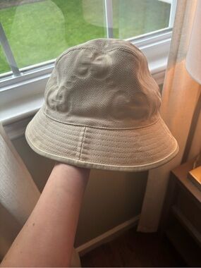 Gucci Embossed Logo Beige Bucket Hat